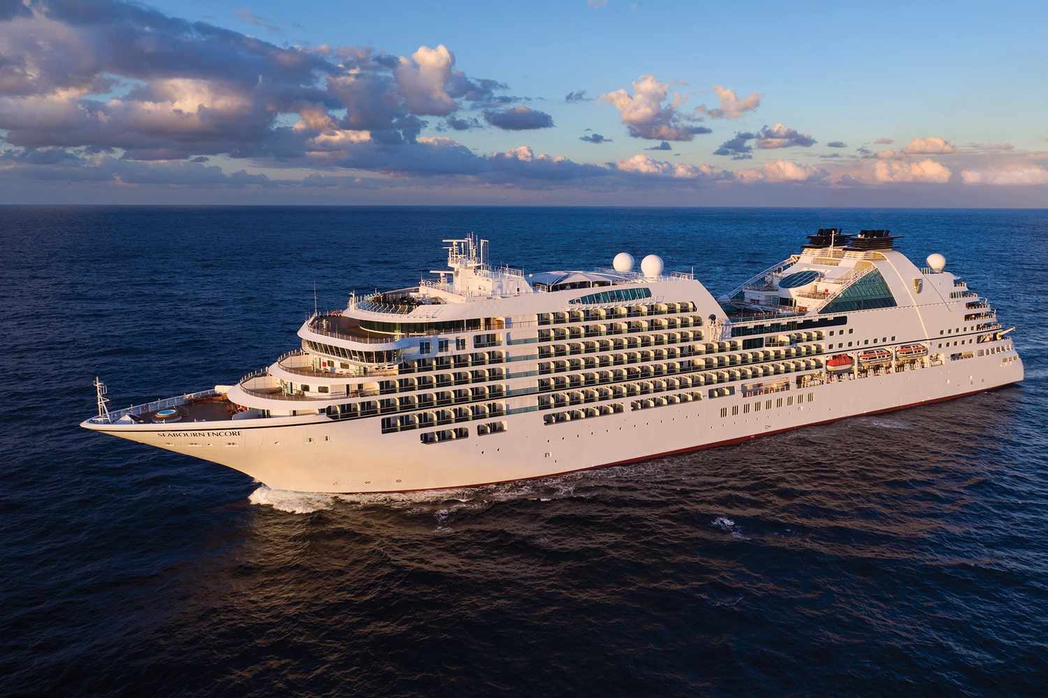 Cruise ship sailing across open turquoise water
