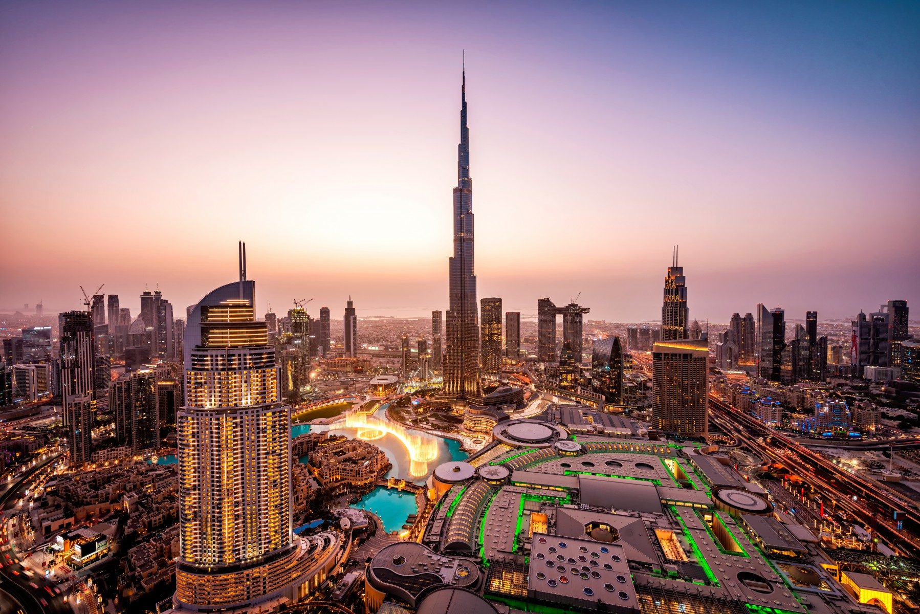 Dubai skyline with modern skyscrapers and desert dunes